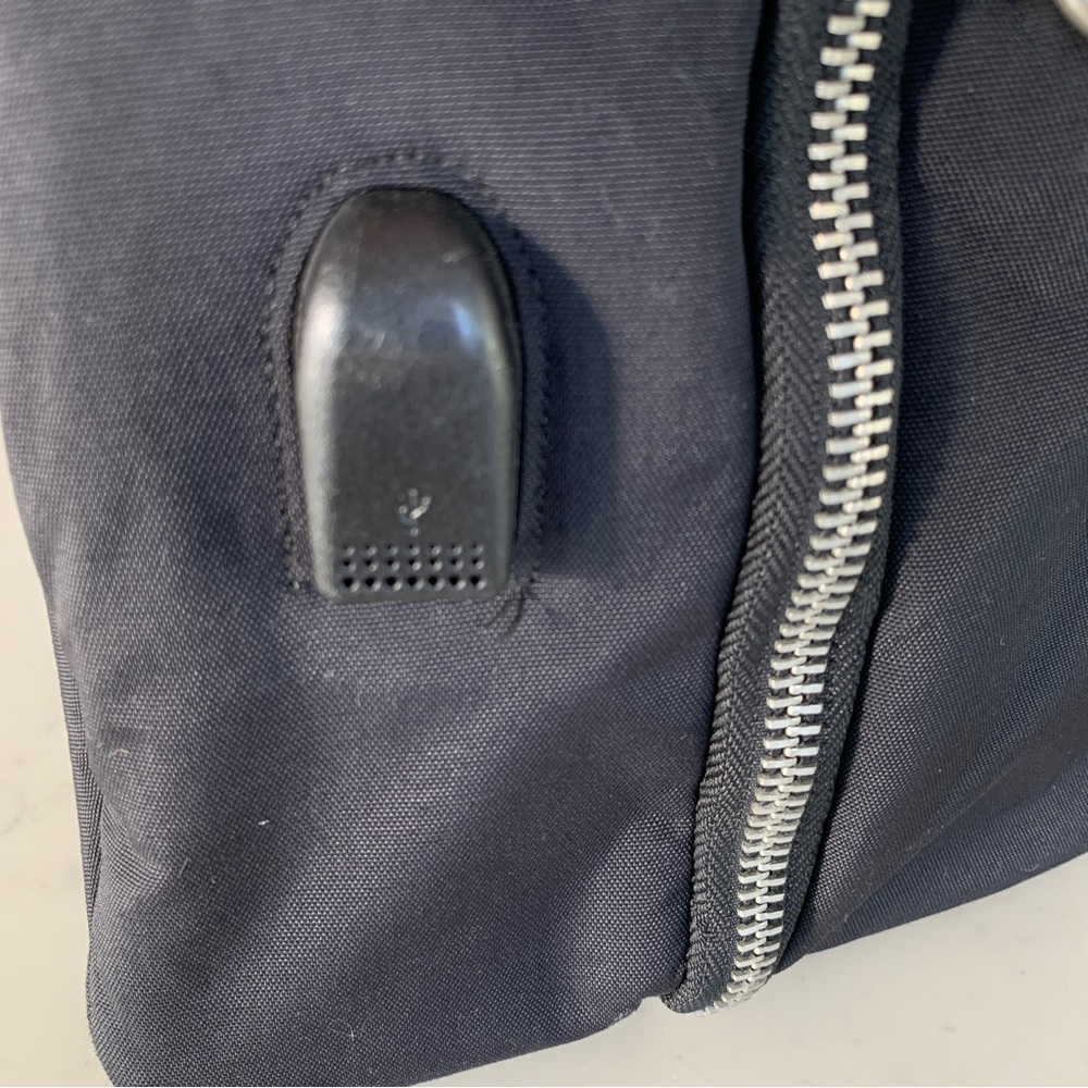 Black Travel Bag with Structured Design and Metal Feet - Picture 9 of 16